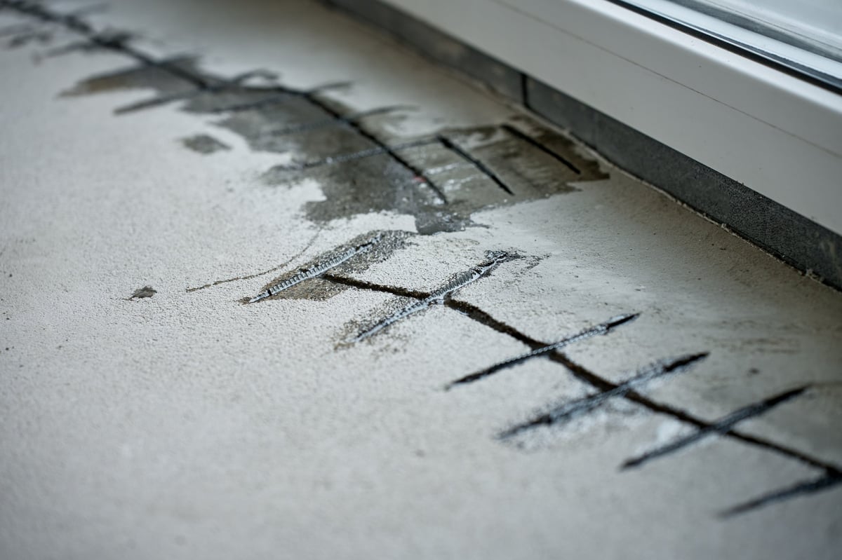 Concrete floor defects being assessed and repaired ahead of a resin flooring installation