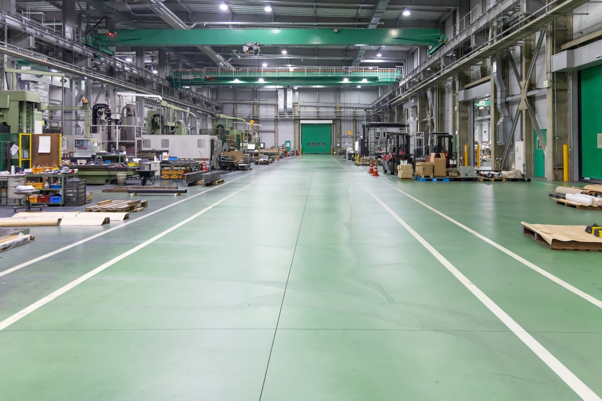 Empty industrial unit floor surveyed ahead of specifying a resin flooring system
